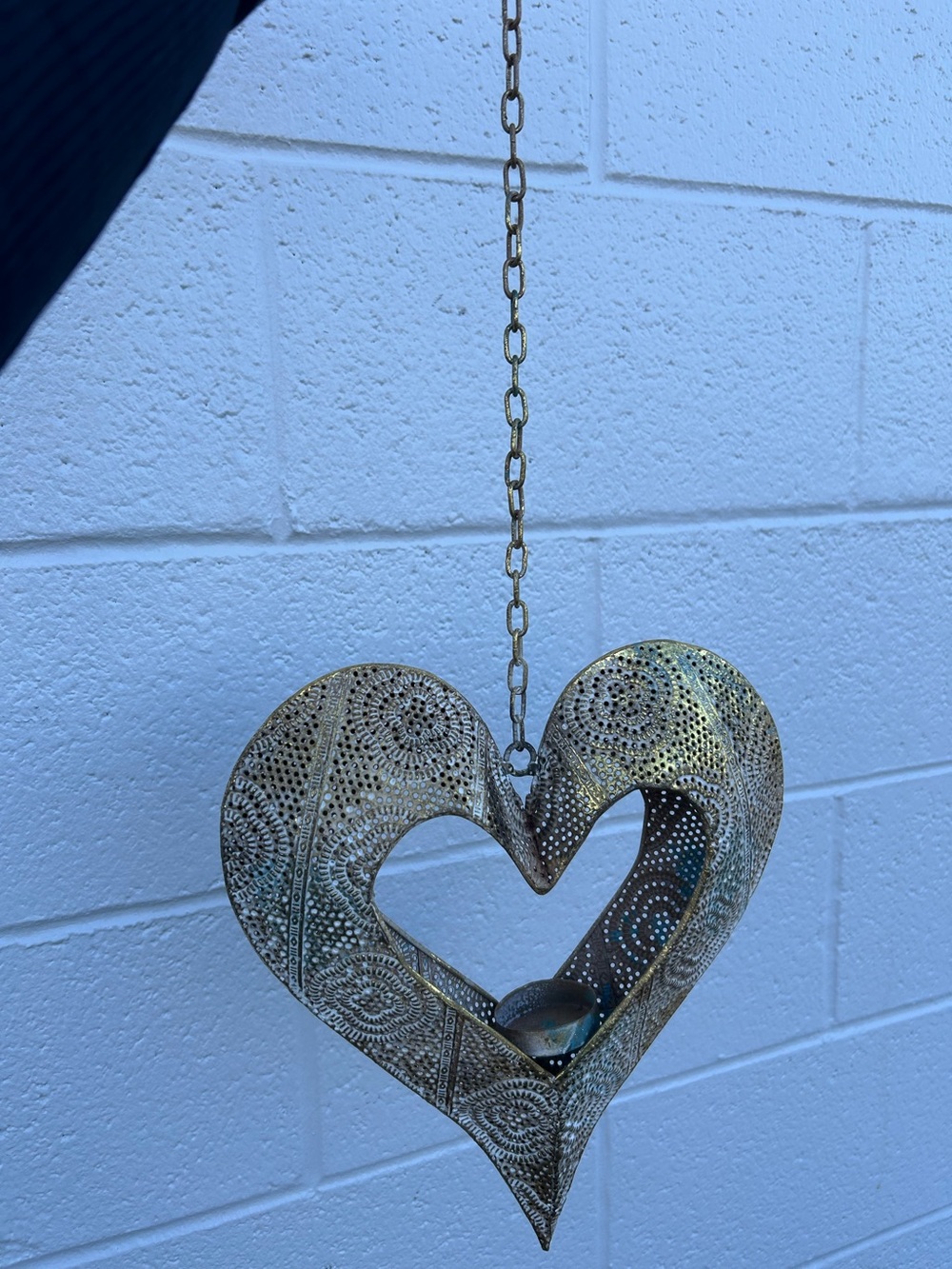 Gold heart shaped lantern is designed with Moroccan inspiration decor